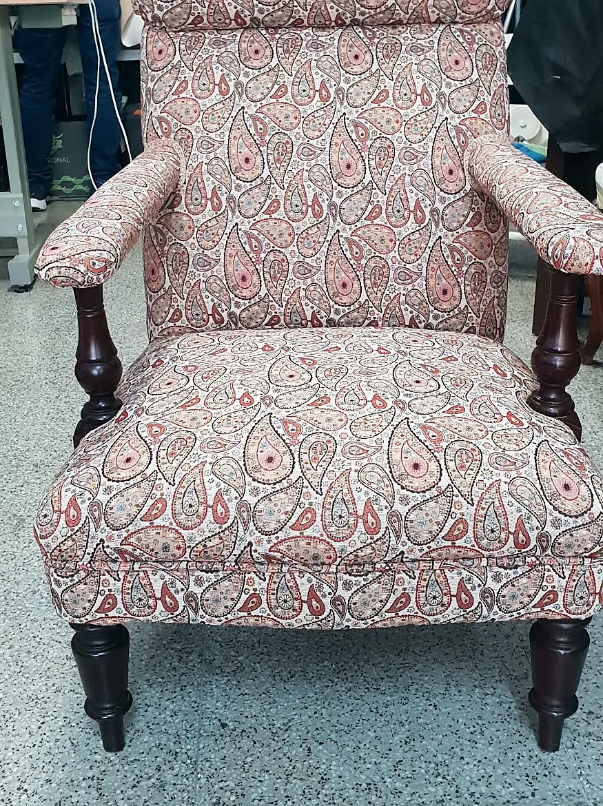 Wooden armchair upholstered in paisley fabric