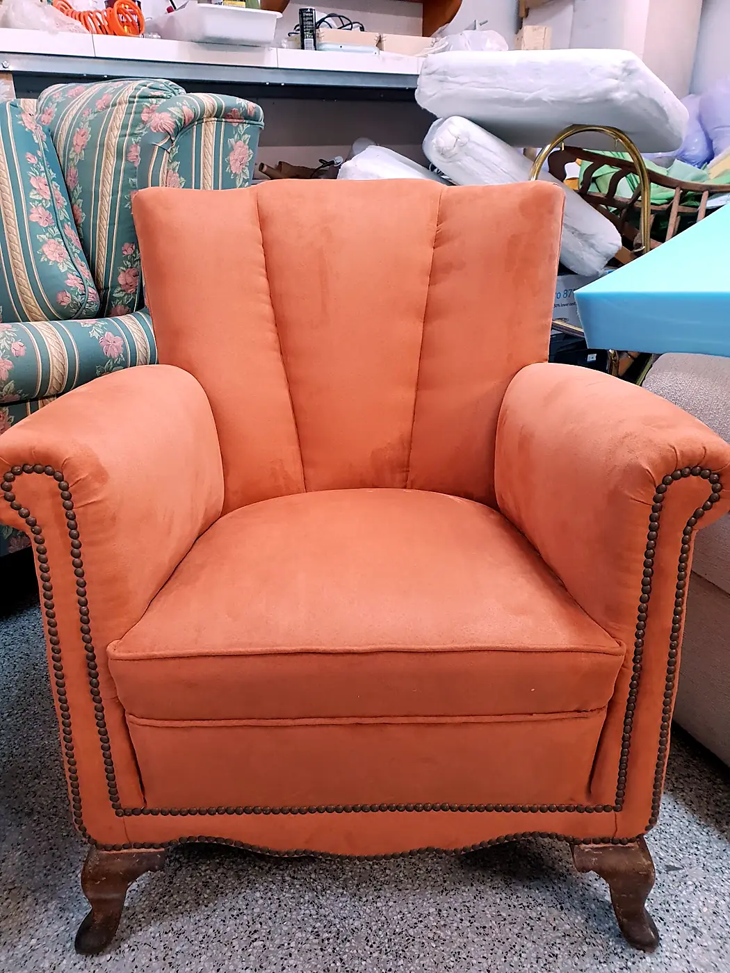 Terracotta armchair finished with studs