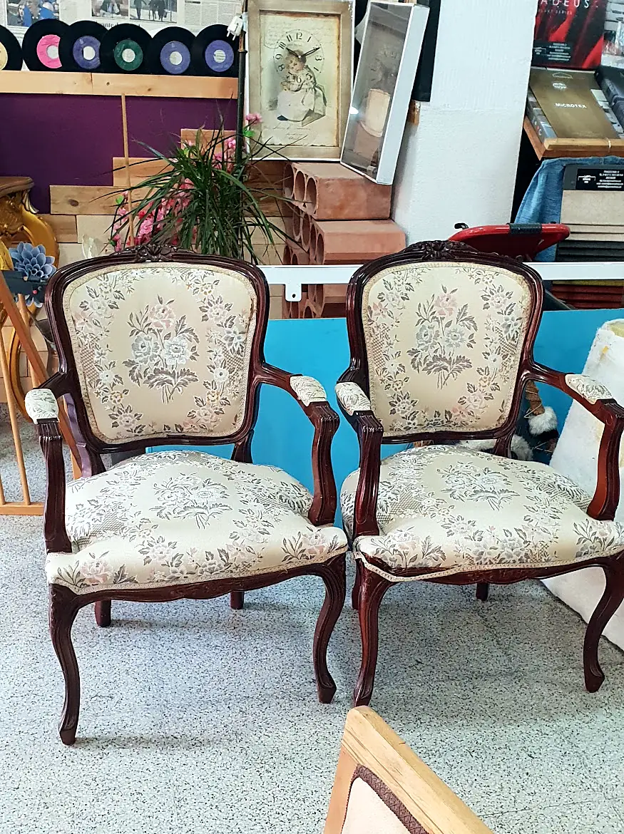 Pair of carved wooden armchairs in embroidered fabric